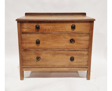 Early 20th century oak chest&nbsp;of three long graduating drawers, with upstand and carved moulded edge and reeded carved si