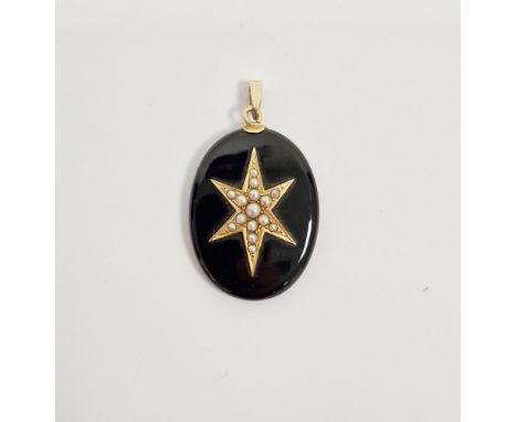 Victorian black onyx oval mourning pendant, the front with applied yellow-metal star set with fifteen seed pearls, the revers