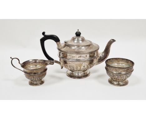 Silver three piece tea service, Sheffield 1933 and 1934, Walker &amp; Hall, comprising teapot with ebony handle and knop 16cm