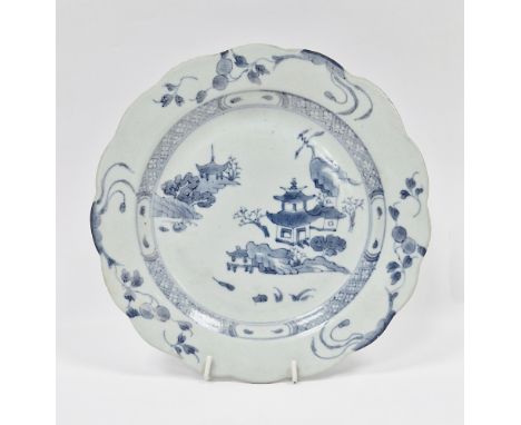 18th century Chinese ' Nanking cargo ' porcelain blue and white plate with scalloped edge and decorated with pagodas, Christi