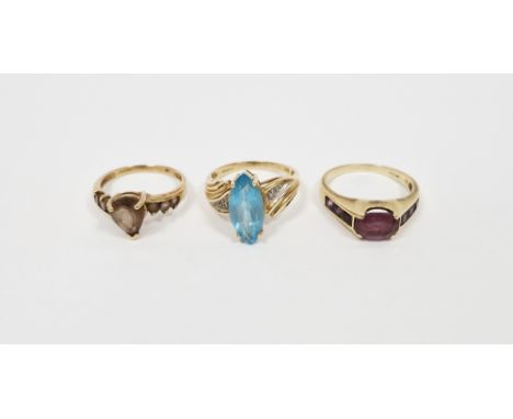 9ct gold and purple stone set dress ring, a 9ct gold and brown stone dress ring and a 9ct gold and turquoise-coloured stone d
