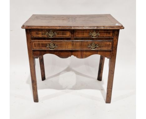 18th century walnut lowboy, the quarter veneer top with broad cross-banded border and moulded ogee edge, above two short and 