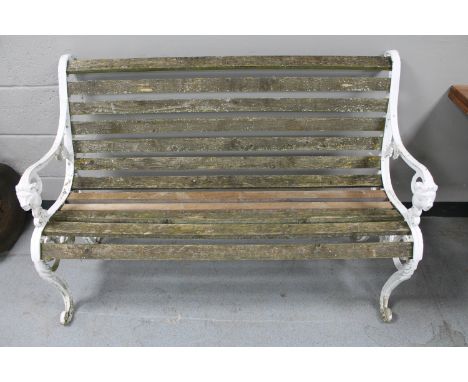 A cast iron wooden slatted garden bench