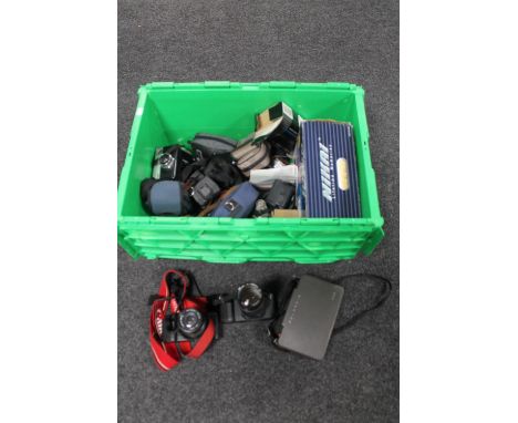A box of vintage cameras - Polaroid 340, Canon T50 etc 