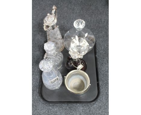 A tray of crystal decanters, silver Scotch label, ship's decanter, claret jug etc 