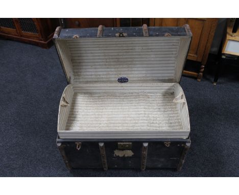 An early 20th century dome topped trunk