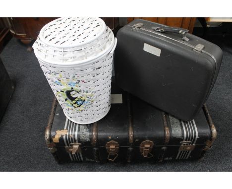 A wooden bound travelling trunk together with a wicker linen basket and a mid century luggage case 