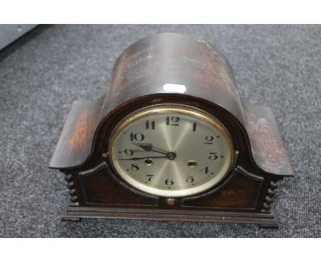 An Edwardian oak mantel clock