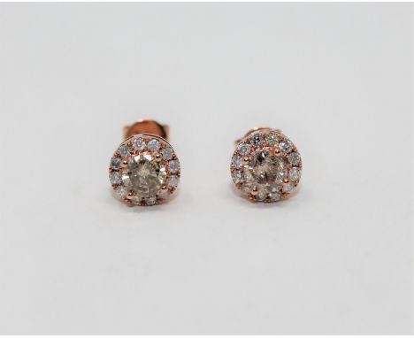 A pair of 14ct rose gold diamond cluster earrings, set with central fancy light-brown brilliant cut diamonds each weighing 0.