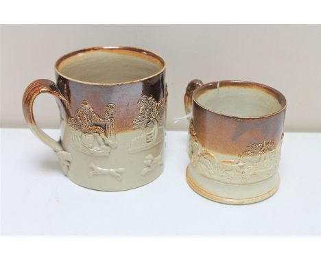 Two antique stoneware mugs depicting hunting and farming scenes. (2)