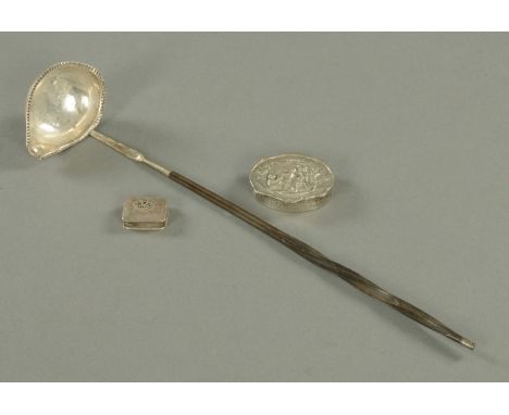 A Georgian silver coloured toddy ladle, with whale bone handle, length 35 cm, a Continental silver coloured snuffbox the top 