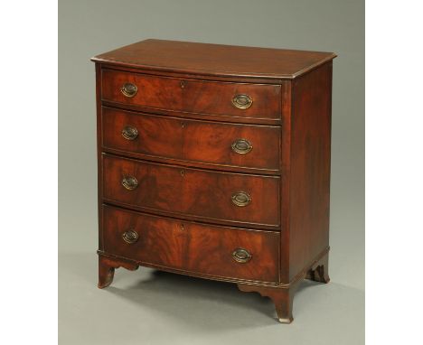 A mahogany chest of drawers, bearing plaque "Wylie & Lochead Ltd., Glasgow", with four graduated drawers and raised on bracke