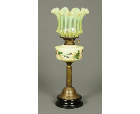 A Victorian brass oil lamp, with Vaseline glass shade and green glass reservoir with handpainted foliate decoration.    CONDI