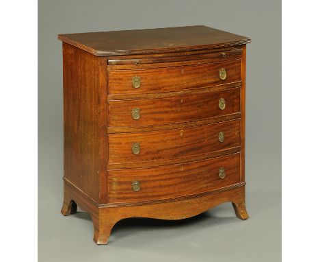 A mahogany bowfronted chest of drawers, with slide above four long drawers with brass drop handles and raised on bracket feet