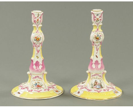 A pair of 19th century Meissen candlesticks, decorated with birds and insects, crossed swords mark to base.  Height 27 cm (se