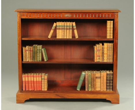 An Edwardian mahogany open bookcase, with moulded cornice, recessed frieze, adjustable shelves and bracket feet.  Width 123 c