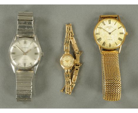 A vintage gentleman's wristwatch by Garrard, another Rotary and a ladies 9 ct cocktail watch. 