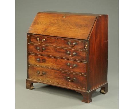 A George III mahogany bureau, with slope front to fitted interior above a series of drawers and raised on bracket feet.  Widt