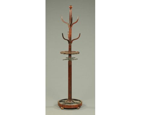 A 19th century mahogany hat and coat stand, with circular shelf, umbrella supports and drip trays.    CONDITION REPORT:  One 