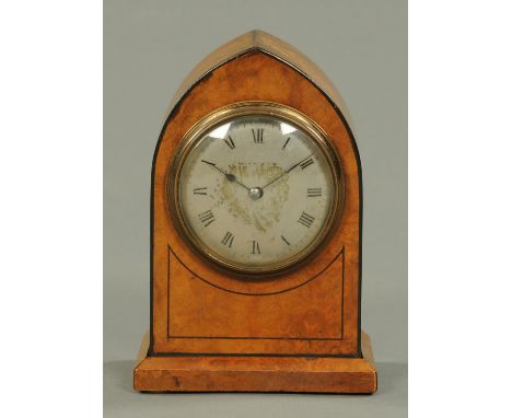 An Edwardian walnut mantle clock, of Lancet shape, ebony strung and with French single-train movement and silvered brass dial