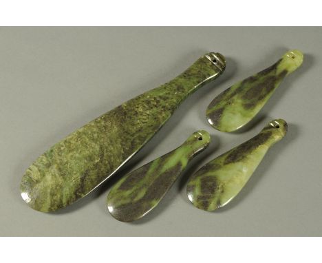 A Maori jade Patu, length 35 cm, and three smaller, each length 17.5 cm. 