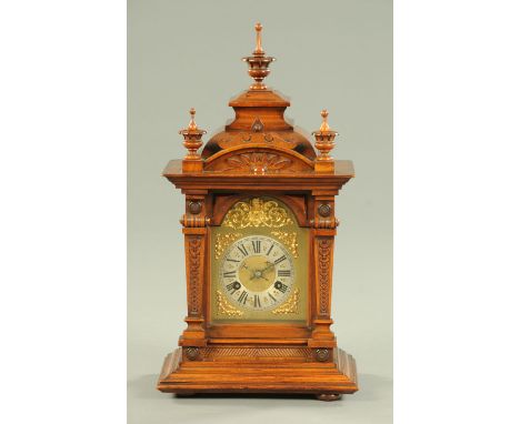 A late 19th century mantle clock, with two-train striking movement and with silvered brass dial.  Width 27 cm. 