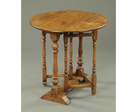 An 18th century oak gate leg table, twin drop flap, with turned supports.  Width 69 cm, length open 66 cm.    CONDITION REPOR