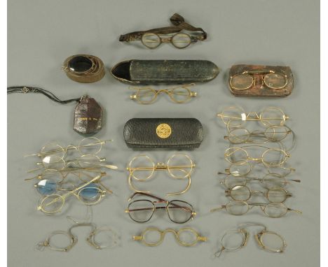 A collection of vintage spectacles, and spectacle cases.  