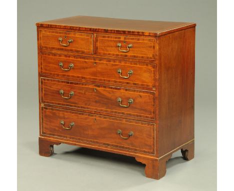 A 19th century mahogany chest of drawers, with two short and three long drawers with brass drop handles, crossbanded drawer f
