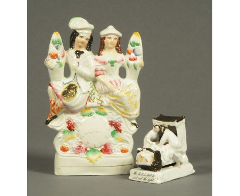 A Victorian fairing, "The Last in Bed to Put Out The Light" and a Staffordshire figure group.  Tallest 22 cm. 