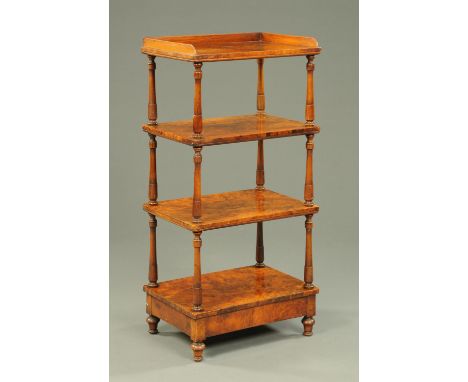 A Victorian walnut four tier whatnot stand, raised on short turned legs.  Width 61 cm.    CONDITION REPORT:  The top shelf ve