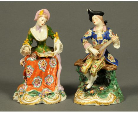 A pair of Derby figures, male musician and female reading music, polychrome.  Height 17 cm (see illustration).    CONDITION R