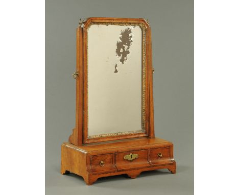 A Georgian walnut dressing table mirror, the base fitted with three drawers and all raised on bracket feet.  Width 38 cm.    