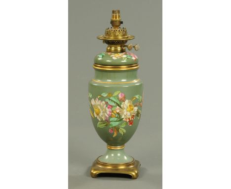 A Victorian foliate decorated ceramic oil lamp, converted.  Height excluding shade 43 cm. 
