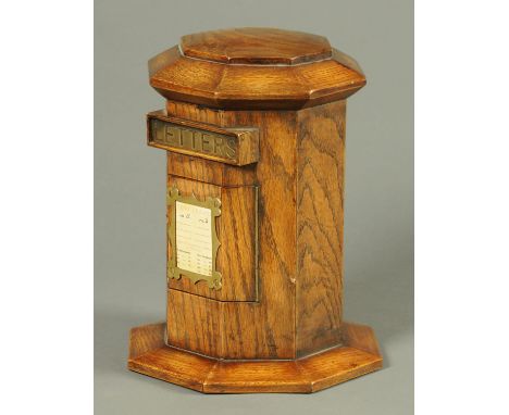 An oak postal box, octagonal.  Height 35 cm. (see illustration).   CONDITION REPORT:  This post box is in generally very good