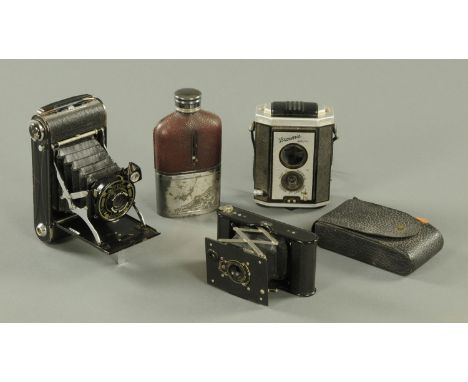 Three vintage cameras, and a hip flask. 