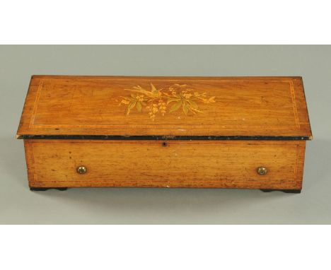 A Victorian inlaid rosewood cased music box, with 38 cm comb, playing ten airs.  Case width 63 cm.    CONDITION REPORT:  The 