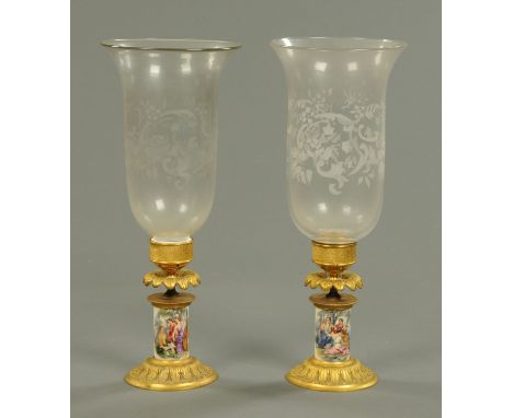 A pair of gilt brass porcelain and glass storm lamps, with etched glass shades.  Height 41.5 cm.    CONDITION REPORT:  Both s