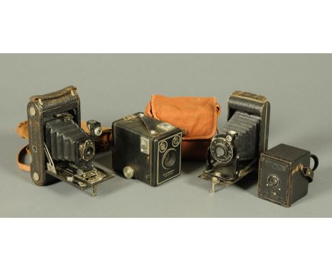 A vintage Kodak Hawk Eye Ace Deluxe box camera, and three other cameras. 