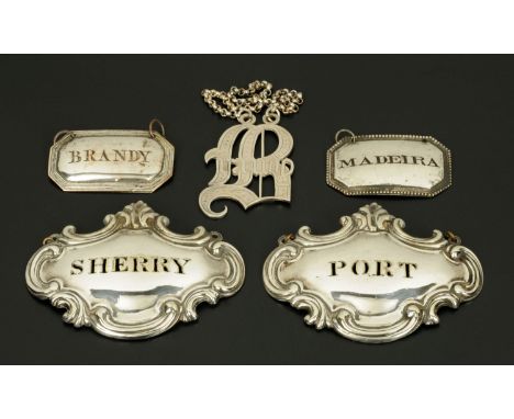 Five decanter labels, plated, including Brandy, Sherry, Port and Madeira.  