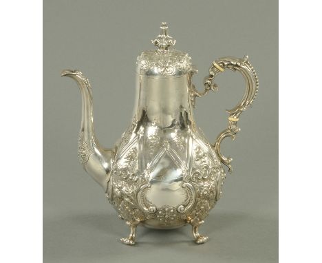 A Victorian silver coffee pot, London 1868, by Daniel & Charles Houle, 974 grams.  Height 27 cm. 
