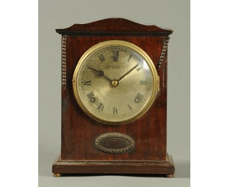 An Edwardian mahogany mantle clock, by Perser & Sons, Portsmouth.  Height 29 cm. 