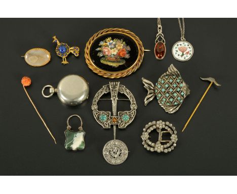 A collection of Scottish brooches, stick pins, amber pendant, silver padlock, etc. 