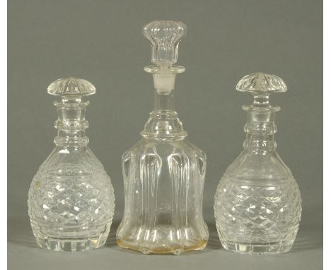 A pair of cut glass decanters, and a Victorian moulded glass decanter.    CONDITION REPORT:  The pair of decanters are both d
