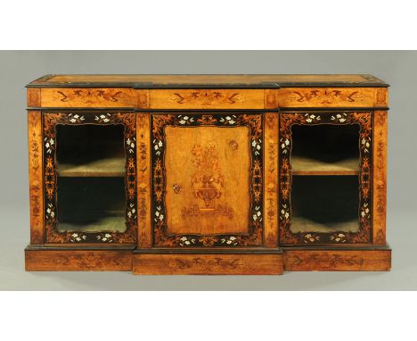 A Victorian walnut and coromandel wood marquetry breakfront side cabinet, with centre panelled door flanked on either side by