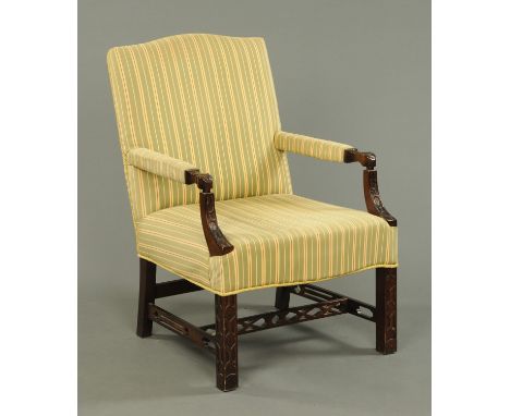 A 20th century Chinese Chippendale style upholstered mahogany library chair (see illustration).    CONDITION REPORT:  The cha