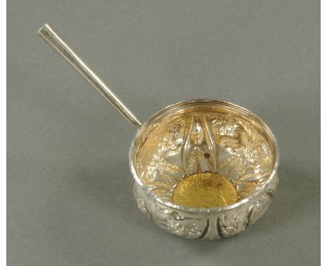 A silver coloured metal punch ladle bowl, with 1745 shilling to base.  Diameter 5.5 cm. 