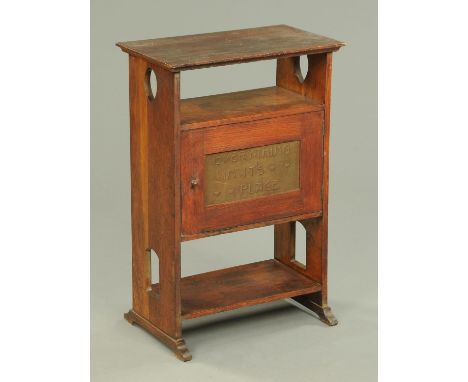 An Arts & Crafts oak side cabinet, with open shelf and cupboard with metal plaque stamped "Everything In Its Place".  Width 5