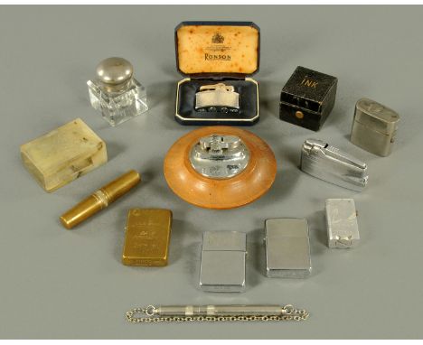 A collection of vintage lighters, inkwells, etc. 