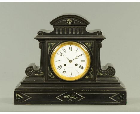 A late 19th century black slate mantle clock, with two-train striking movement.  Width 51 cm. 